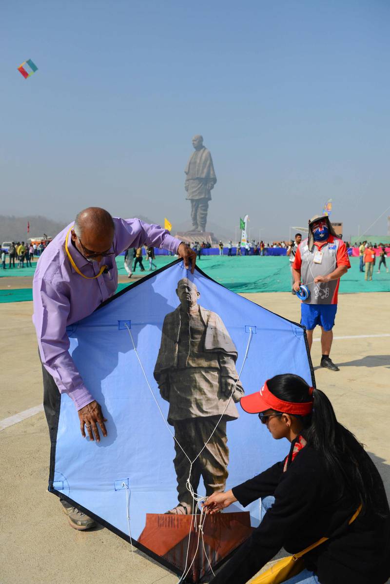 Indian participants prepare to fly a kite decorated with the Statue Of Unity. AFP
