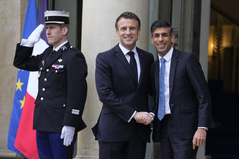 France's President Emmanuel Macron welcomes Britain's Prime Minister Rishi Sunak to the Elysee Palace in Paris on March 10. AP