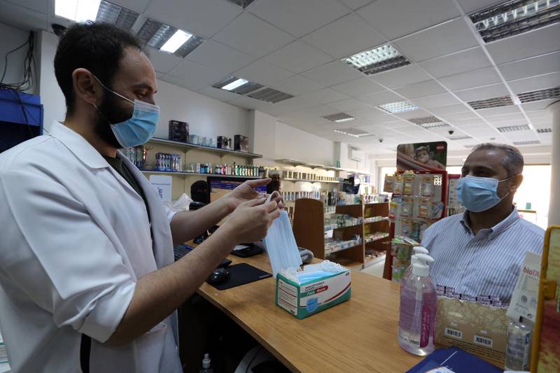 A man buys masks from a pharmacy in Riyadh, Saudi Arabia. Reuters