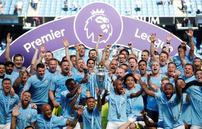 Soccer Football - Premier League - Manchester City vs Huddersfield Town - Etihad Stadium, Manchester, Britain - May 6, 2018   Manchester City manager Pep Guardiola celebrates with the trophy, players and staff after winning the Premier League title   Action Images via Reuters/Carl Recine    EDITORIAL USE ONLY. No use with unauthorized audio, video, data, fixture lists, club/league logos or "live" services. Online in-match use limited to 75 images, no video emulation. No use in betting, games or single club/league/player publications.  Please contact your account representative for further details.