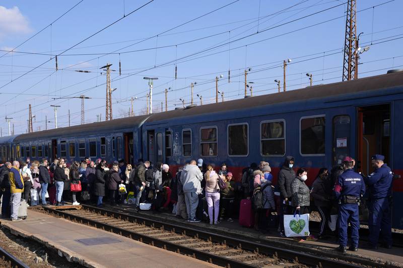 People board a train to return to Ukraine after getting supplies in Zahony, Hungary.  AP Photo