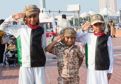 Abu Dhabi, United Arab Emirates - Local kids dressed up for the UAE National day at Abu Dhabi Corniche, Breakwater.  Leslie Pableo for The National