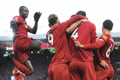 LIVERPOOL, ENGLAND - NOVEMBER 30: Virgil van Dijk of Liverpool celebrates scoring his teams second goal with team mates during the Premier League match between Liverpool FC and Brighton & Hove Albion at Anfield on November 30, 2019 in Liverpool, United Kingdom. (Photo by Clive Brunskill/Getty Images)