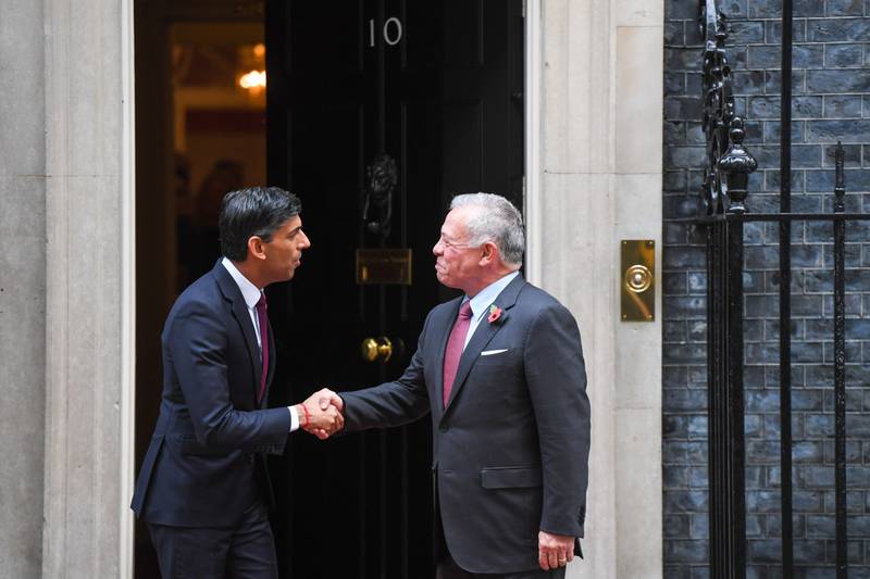 Rishi Sunak shakes hands with King Abdullah prior to their meeting. Bloomberg