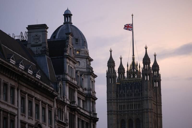 The Union flag is lowered at the Houses of Parliament following the death of Queen Elizabeth II on September 08, 2022 in London, England. Getty