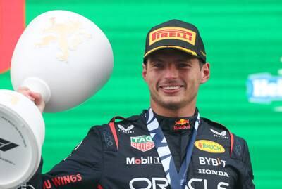 Max Verstappen of Red Bull celebrates on the podium after winning the Dutch Grand Prix at Circuit Zandvoort on August 27, 2023, to equal the record of nine victories in a row. Getty
