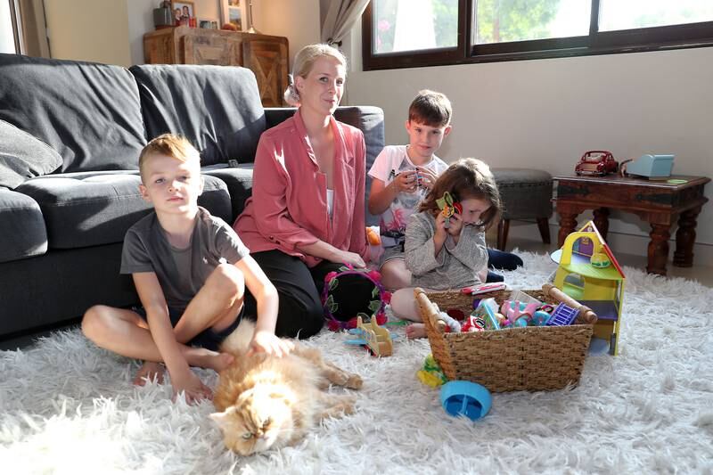 Ffion Tomlinson with her children Oliver, Toby and Lola at her villa in Dubai. She has opted to spend the holiday in Dubai, rather than the UK, because of flight costs. Pawan Singh / The National