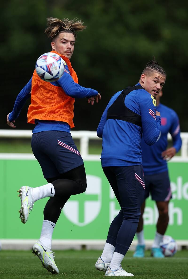 Jack Grealish and Kalvin Phillips of England battle for the ball.