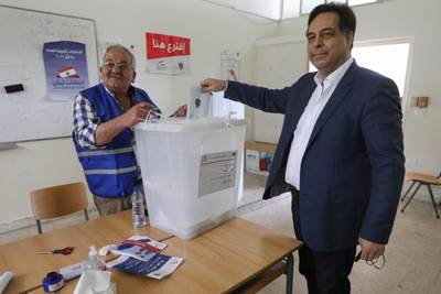 Former prime minister Hassan Diab, who succeeded Saad Hariri, casts his ballot in Beirut. AFP