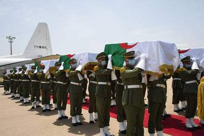A handout picture provided by the Algerian Presidency Press Service, shows the official ceremony for receiving the remains of 24 Algerian resistance fighters decapitated during the French colonial conquest of the North African country, each in a coffin draped with the national flag, following their arrival at Algiers airport on a flight from France on July 3, 2020. To a military guard of honour and with President Abdelmajid Tebboune at the scene, the remains were flown in to Algiers on a Hercules C-130 transport plane, accompanied by Algerian fighters. France's return of the remains this weekend. France's 132 years of colonial rule, and the brutal eight-year war that ended it, have left a lasting legacy of often prickly relations between the two governments and peoples.  - === RESTRICTED TO EDITORIAL USE - MANDATORY CREDIT "AFP PHOTO / HO / ALGERIAN PRESIDENCY PRESS SERVICE " - NO MARKETING NO ADVERTISING CAMPAIGNS - DISTRIBUTED AS A SERVICE TO CLIENTS ===
 / AFP / Algerian Presidency Press Office / - / === RESTRICTED TO EDITORIAL USE - MANDATORY CREDIT "AFP PHOTO / HO / ALGERIAN PRESIDENCY PRESS SERVICE " - NO MARKETING NO ADVERTISING CAMPAIGNS - DISTRIBUTED AS A SERVICE TO CLIENTS ===
