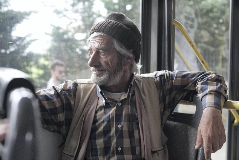 Writing the bus and having just came from voting, Zeki Nuria, 69, fisherman, he says that he voted for AKP because Turkey is going in the right direction. Photo by Shawn Carrié