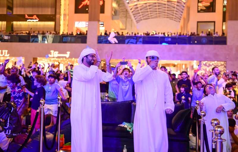 Town Square in Yas Mall drew enthusiastic crowds for Manchester City's Champions League triumph in June. Khushnum Bhandari / The National