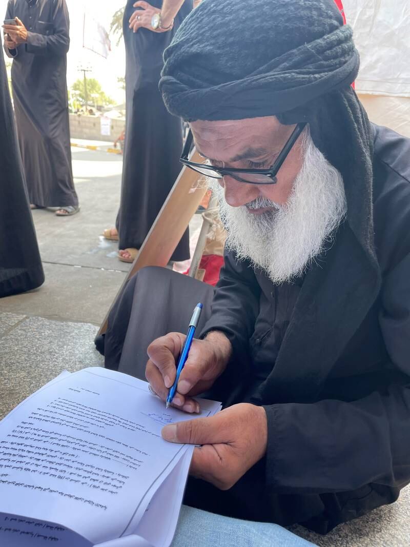 Mohammed Jassim Saad, 60, signs the lawsuit to be sent to the Supreme Federal Court in which he demands that parliament is dissolved and early elections are held. 
