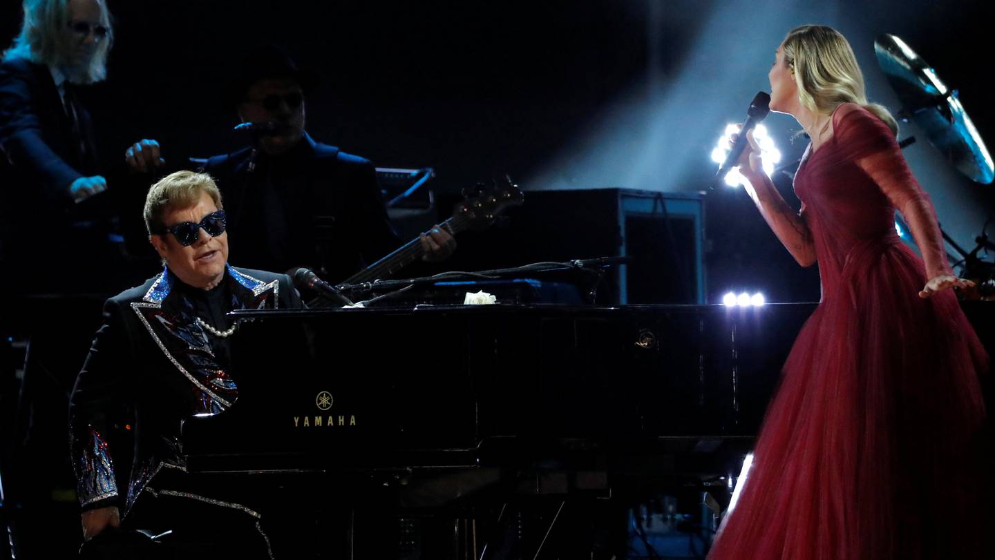 FILE PHOTO: Elton John and Miley Cyrus perform "Tiny Dancer" during the 60th Annual Grammy Awards Show in New York, NY, U.S., January 28, 2018.  REUTERS/Lucas Jackson/File Photo