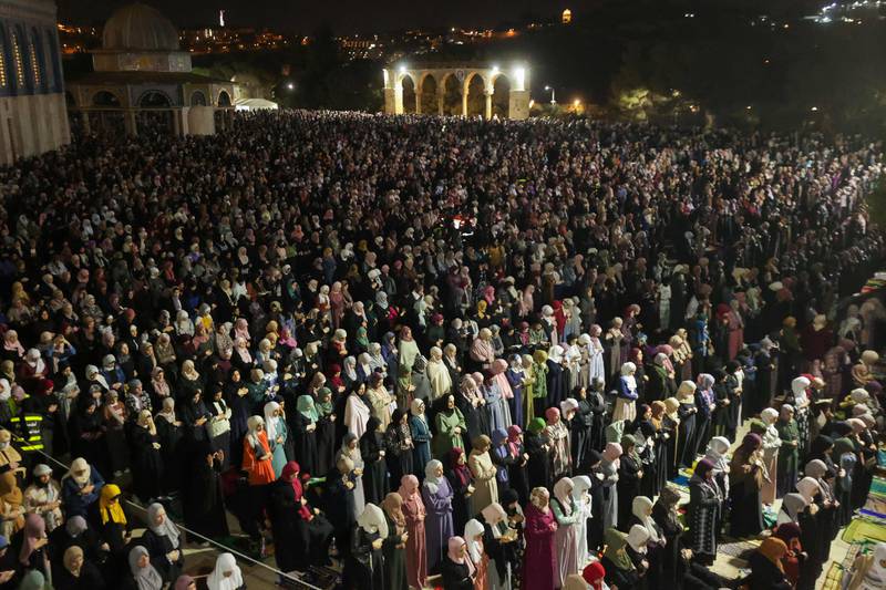 Palestinian devotees pray. AFP