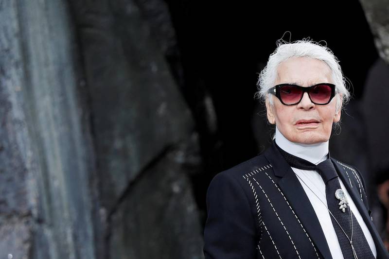 FILE PHOTO -  German designer Karl Lagerfeld appears at the end of his Spring/Summer 2018 women's ready-to-wear collection show for fashion house Chanel at the Grand Palais during Paris Fashion Week, France, October 3, 2017. REUTERS/Gonzalo Fuentes/File Photo