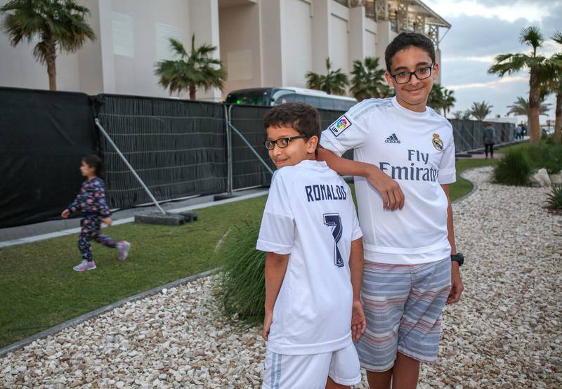 December 12, 2017.  NYU Abu Dhabi.  Build up coverage for the match between Al Jazira and Real Madrid.  (L-R)  Bedair brothers, Ahmed-11 and Ammar-13 trying to get a gimpse of the football players. Victor Besa for The NationalNationalReporter:  Anna Zacharias