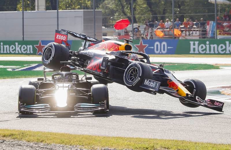 Red Bull's Max Verstappen collides with Lewis Hamilton of Mercedes during the F1 Italian Grand Prix at Monza on September 12. EPA