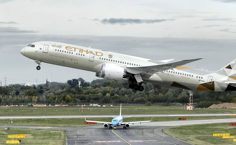 This picture shows a Boeing 787-10 Dreamliner of the Etihad airline during take-off on September 24, 2019 at the airport in Duesseldorf, western Germany. (Photo by Ina FASSBENDER / AFP)