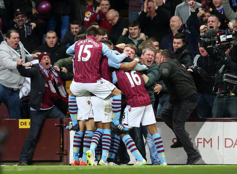 Aston Villa players and fans celebrate after Fabian Delph opened the scoring. Carl Recine / Reuters

