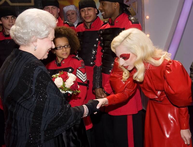 She shakes hands with US singer Lady Gaga in Blackpool, England. Getty
