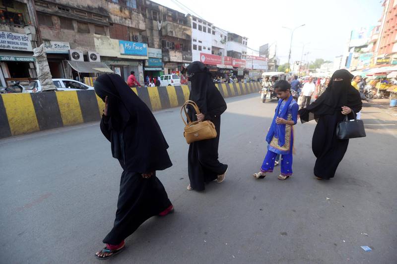 Muslim women walk on the road at Chowk old city  in Lucknow, April 7, 2019. The National/Jitendra Prakash 