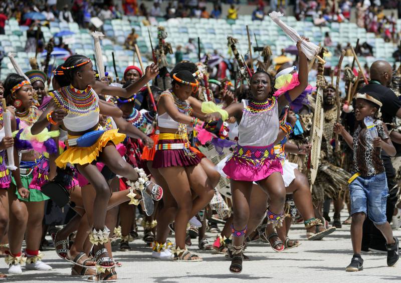 Zulu women sing and dance as they arrive for King Misuzulu's coronation at the Moses Mabhida Stadium in Durban, South Africa. AP
