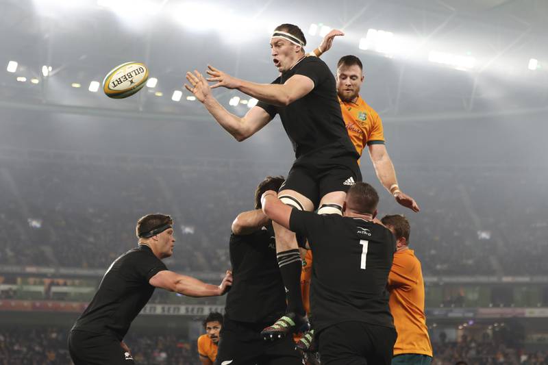 New Zealand's Sam Whitelock, top left, wins a line out while playing Australia in their Bledisloe rugby test in Melbourne, Australia. AP