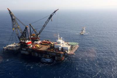This picture taken on January 31, 2019 shows an aerial view of the SSCV Thialf crane vessel laying the newly-arrived foundation platform for the Leviathan natural gas field in the Mediterranean Sea, about 130 kilometres (81 miles) west of the coast of the Israeli city of Haifa. (Photo by Marc Israel SELLEM / POOL / AFP)