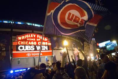 Fans celebrate outside Wrigley Field after the Chicago Cubs defeated the St. Louis Cardinals to win the division championship series on October 13, 2015. The Cubs now advance to the National League Championship Series. Scott Olson / Getty Images



