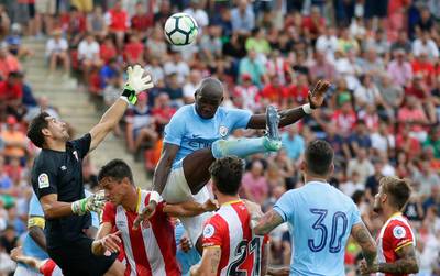 Manchester City defender Eliaquim Mangala, top, could find himself on the move if Pep Guardiola can entice Jonny Evans from West Bromwich Albion. Manu Fernandez / AP Photo