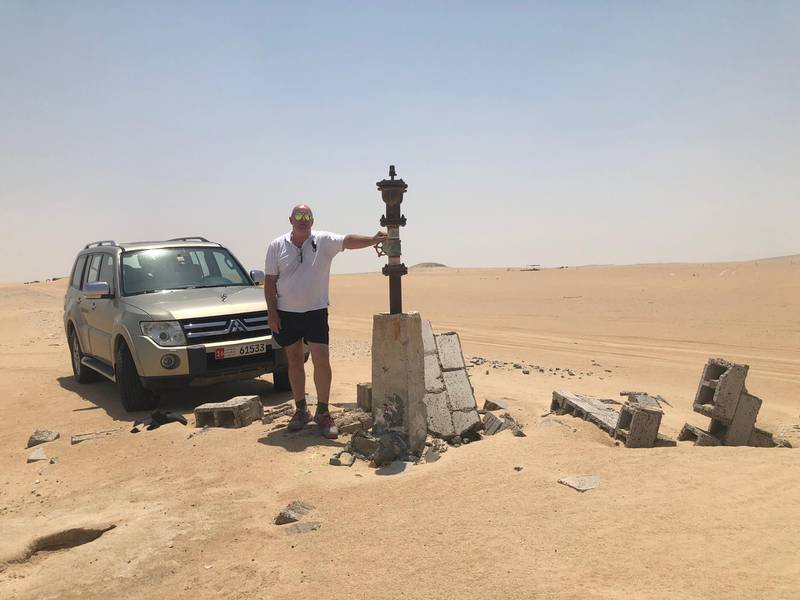 David Pryce back at the camp in 2018. The rudimentary buildings he lived in have been reclaimed by the desert. Courtesy David Pryce