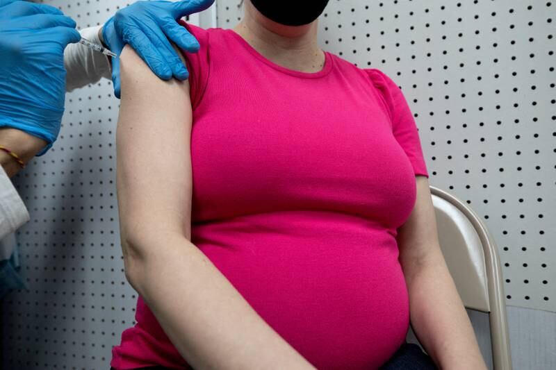 A pregnant woman receives a vaccine for coronavirus at Skippack Pharmacy in Schwenksville, Pennsylvania, US. Reuters
