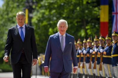 Britain's King Charles III reviews a guard of honour with Romanian President Klaus Iohannis during a welcoming ceremony at the Cotroceni Presidential Palace in Bucharest, Romania. AP