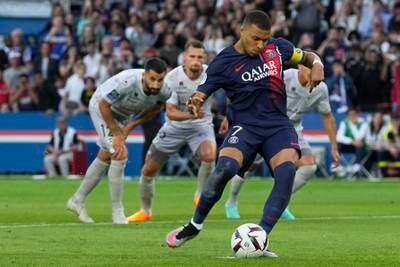 PSG's Kylian Mbappe scores from the spot. AP