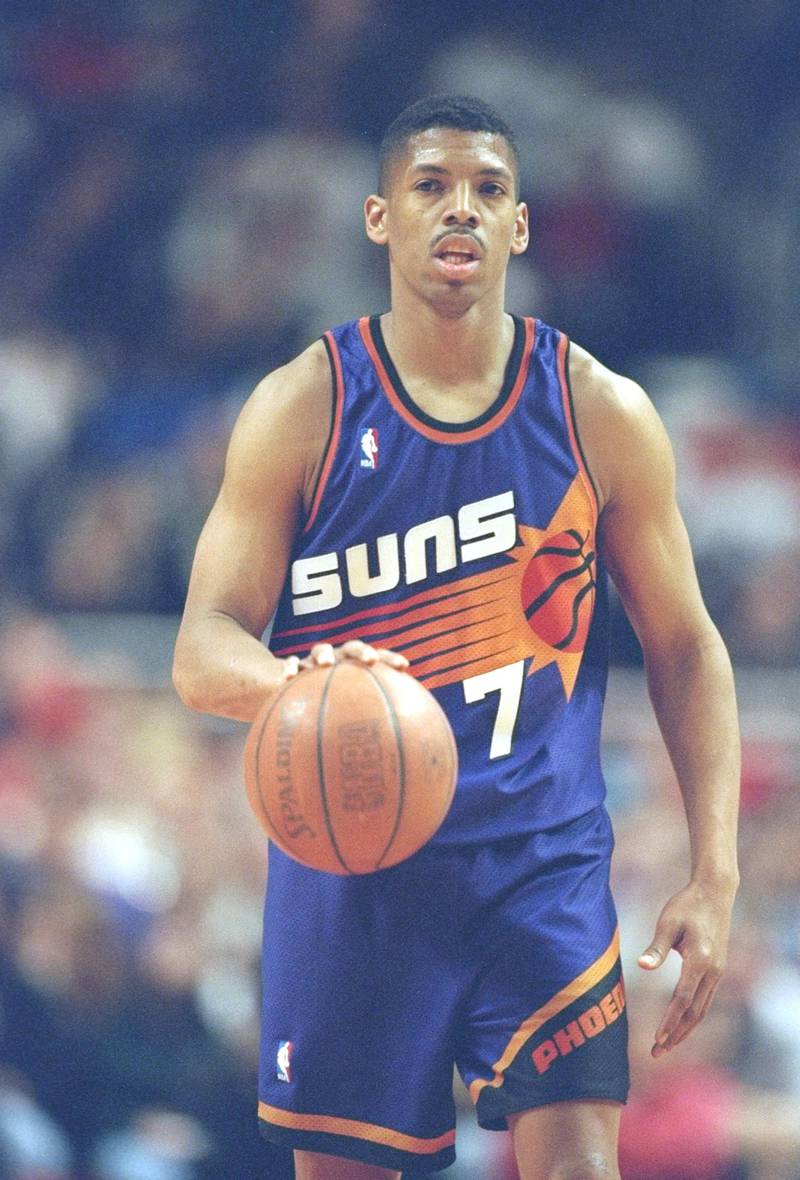 28 Jan 1996: Guard Kevin Johnson of the Phoenix Suns dribbles the ball down the court during a game against the Chicago Bulls at the United Center in Chicago, Illinois. The Bulls won the game 93-82.