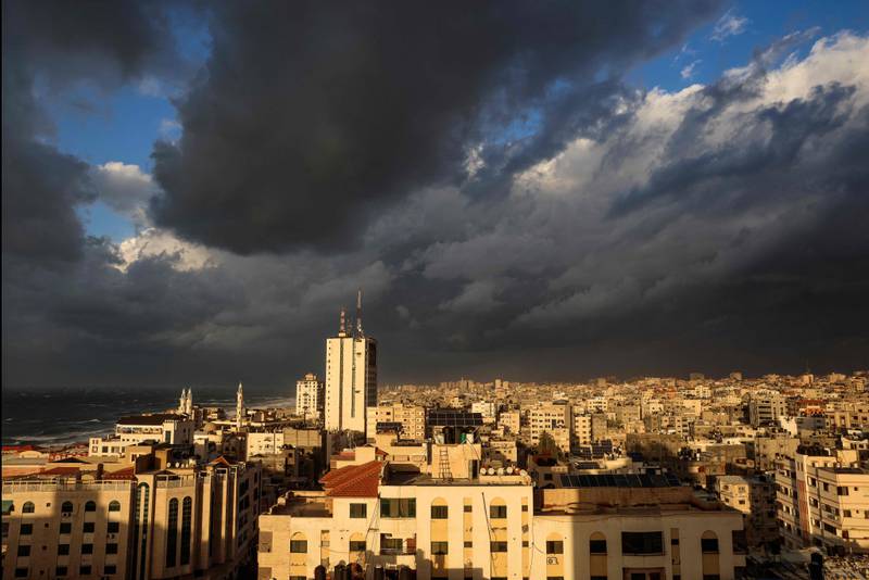 Dark clouds gather above Gaza city during a winter storm. AFP
