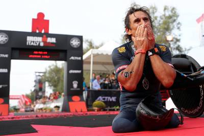 CERVIA, ITALY - SEPTEMBER 22:  Racing Driver Alessandro Zanardi of Italy celebrates finishing IRONMAN Emilia Romagna on September 21, 2018 in Cervia, Italy.  (Photo by Bryn Lennon/Getty Images for IRONMAN)