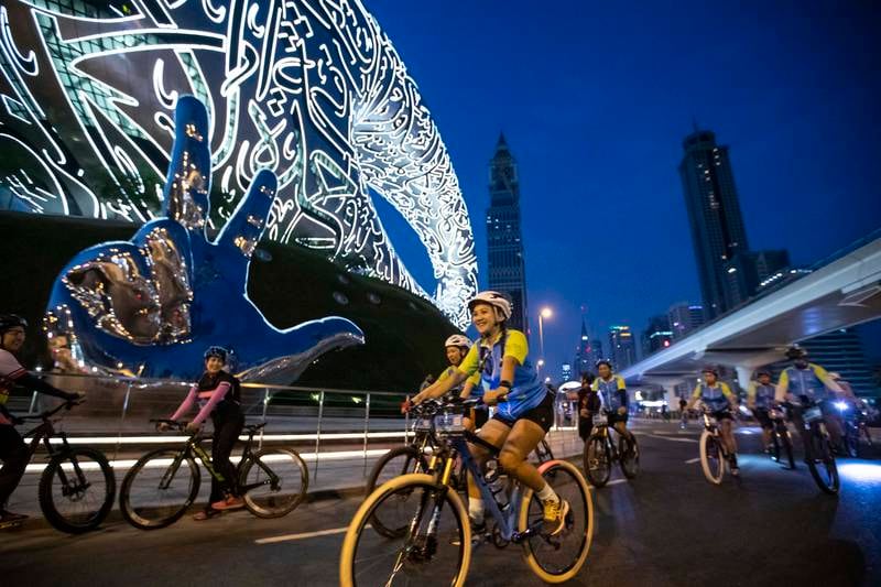 Participants of Dubai Ride 2022 cycling along Sheikh Zayed Road. Ruel Pableo for The National