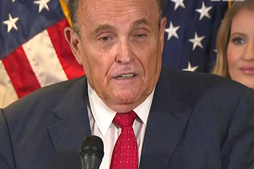 Rudy Giuliani sweats hair dye at election press update