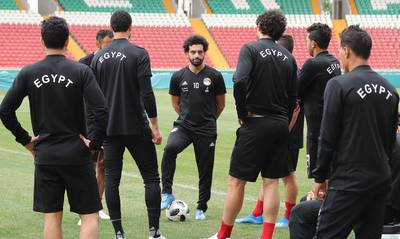 Egypt's forward Mohamed Salah, centre, speaks to his teammates during a training session at the Akhmat Arena stadium in Grozny ahead of Tuesday's match with Russia. Karim Jaafar / AFP
