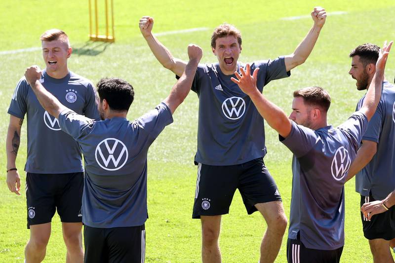 Thomas Muller, centre, with teammates. Getty