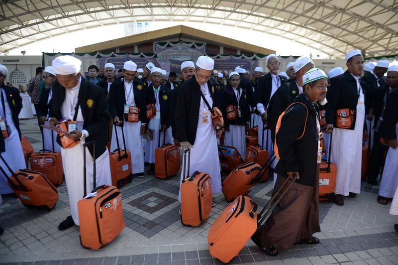Thai Muslims board a special flight to Makkah from Narathiwat provincial airport in southern Thailand.  AFP