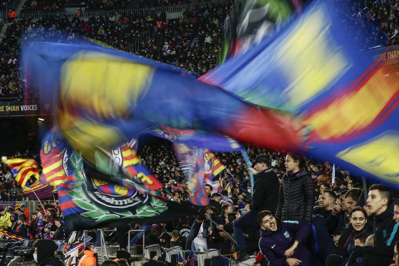 Barcelona supporters celebrate after Pedri scored the opening goal against Sevilla. AP