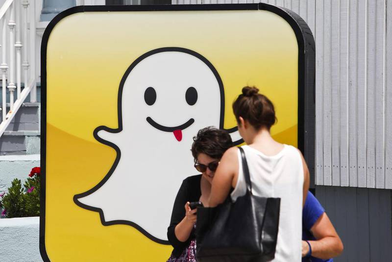 People take pictures in front of the Snapchat headquarters at Venice Beach in Los Angeles. Bloomberg
