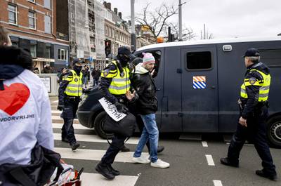 Police start clearing the area of protesters during an anti-lockdown demonstration in Amsterdam, the Netherlands. EPA