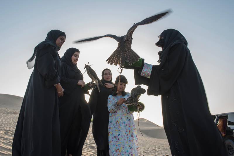 Emirati Women regularly come together in the evenings to meet and train their birds where the practice becomes more about friendship and sharing knowledge than subsistence. (From left to right) Mariam Al Hammadi, Emam Al Hammadi, Khawla Al Hammadi, Osha Khaleefa Al Mansoori, Ayesha Al Manoori head trainer for the female section in Abu Dhabi Falcon Club, a government-owned organization which promotes falconry in UAE.Vidhyaa for The National