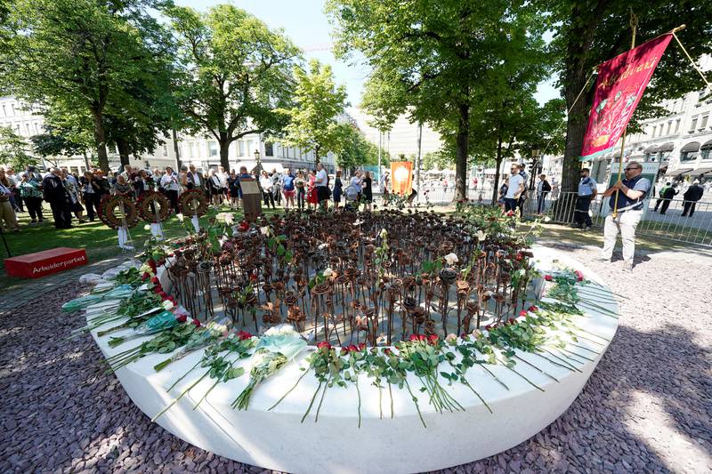 People gather at a memorial outside Oslo Cathedral. Reuters