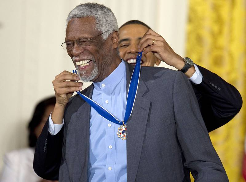 Former US president Barack Obama awards the 2010 Medal of Freedom to NBA basketball hall of famer and human rights advocate Bill Russell during a ceremony at the White House in Washington. AFP