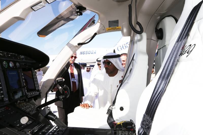 DUBAI , UNITED ARAB EMIRATES Ð Dec 8 , 2014 : Sheikh Ahmed Bin Saeed Al Maktoum , President of the Department of Civil Aviation , CEO and Chairman of The Emirates Group and Chairman of Dubai World looking the Bell helicopter during his visit at the Middle East Business Aviation air show held at Dubai World Central in Dubai. ( Pawan Singh / The National ) For Business. Story by Shereen Elgazzar